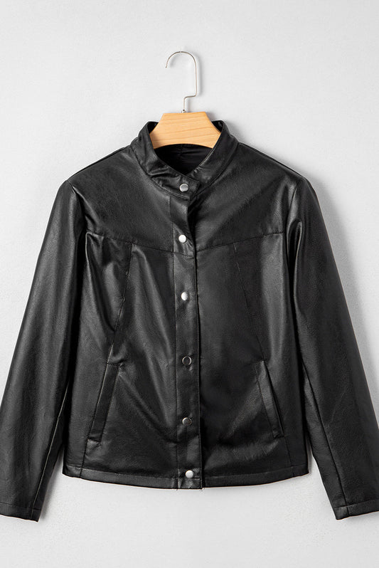 Black leather jacket on a hanger against a white background